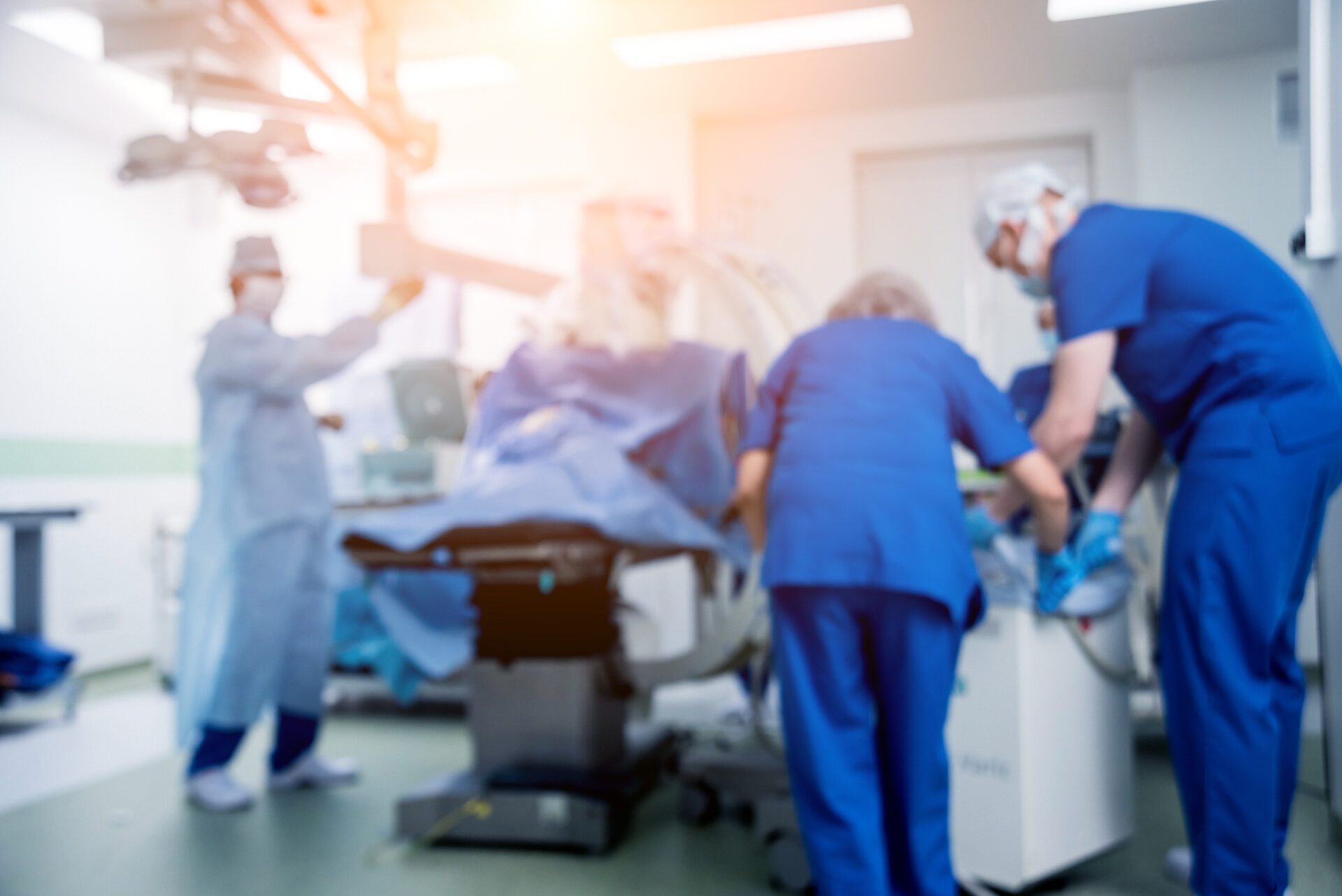 Process of trauma surgery operation. Group of surgeons in operating room Festival of Trees event space
